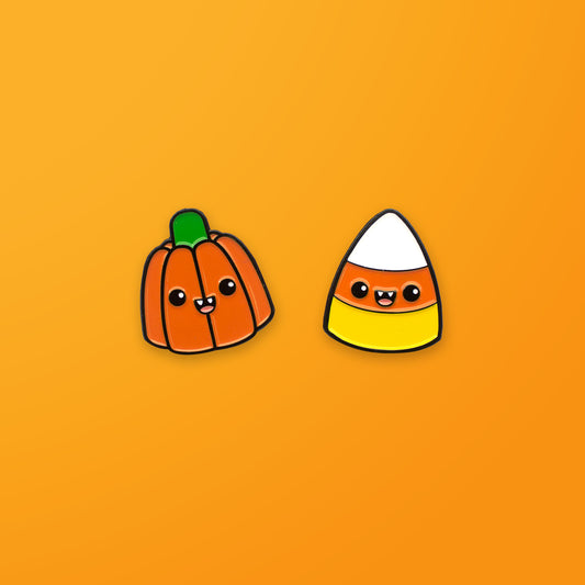 Halloween Pumpkin and Candy Corn enamel pin set on orange background