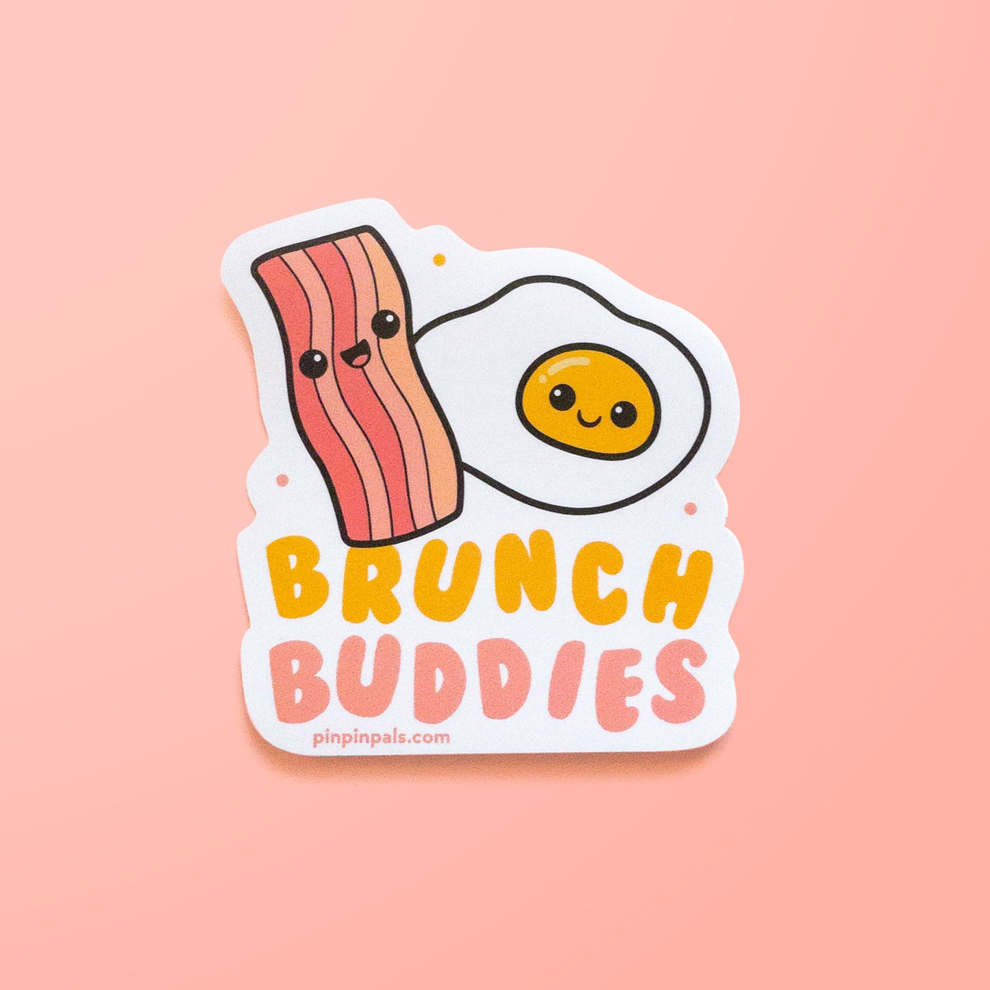 Brunch buddies - egg and bacon vinyl sticker on pink background
