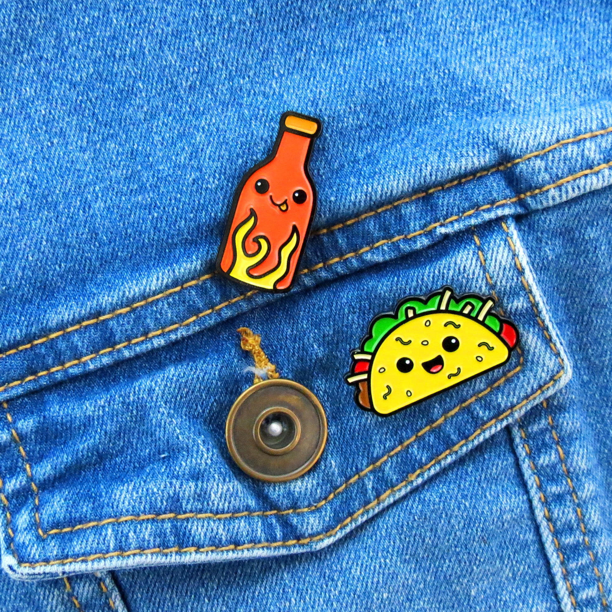 Taco and Hot Sauce enamel pins on jean jacket pocket
