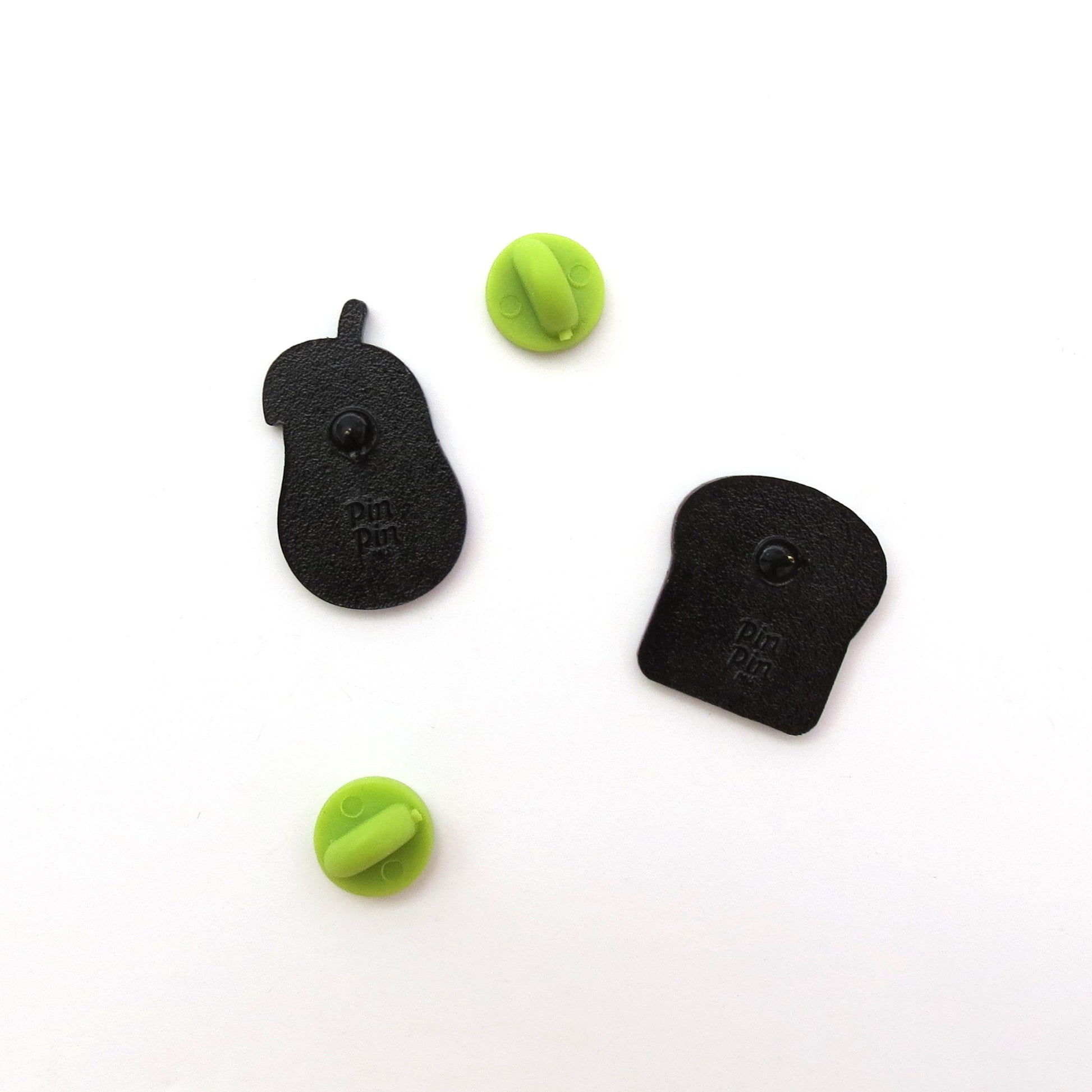 Showing back of Avocado and Toast enamel pin set with green rubber backings