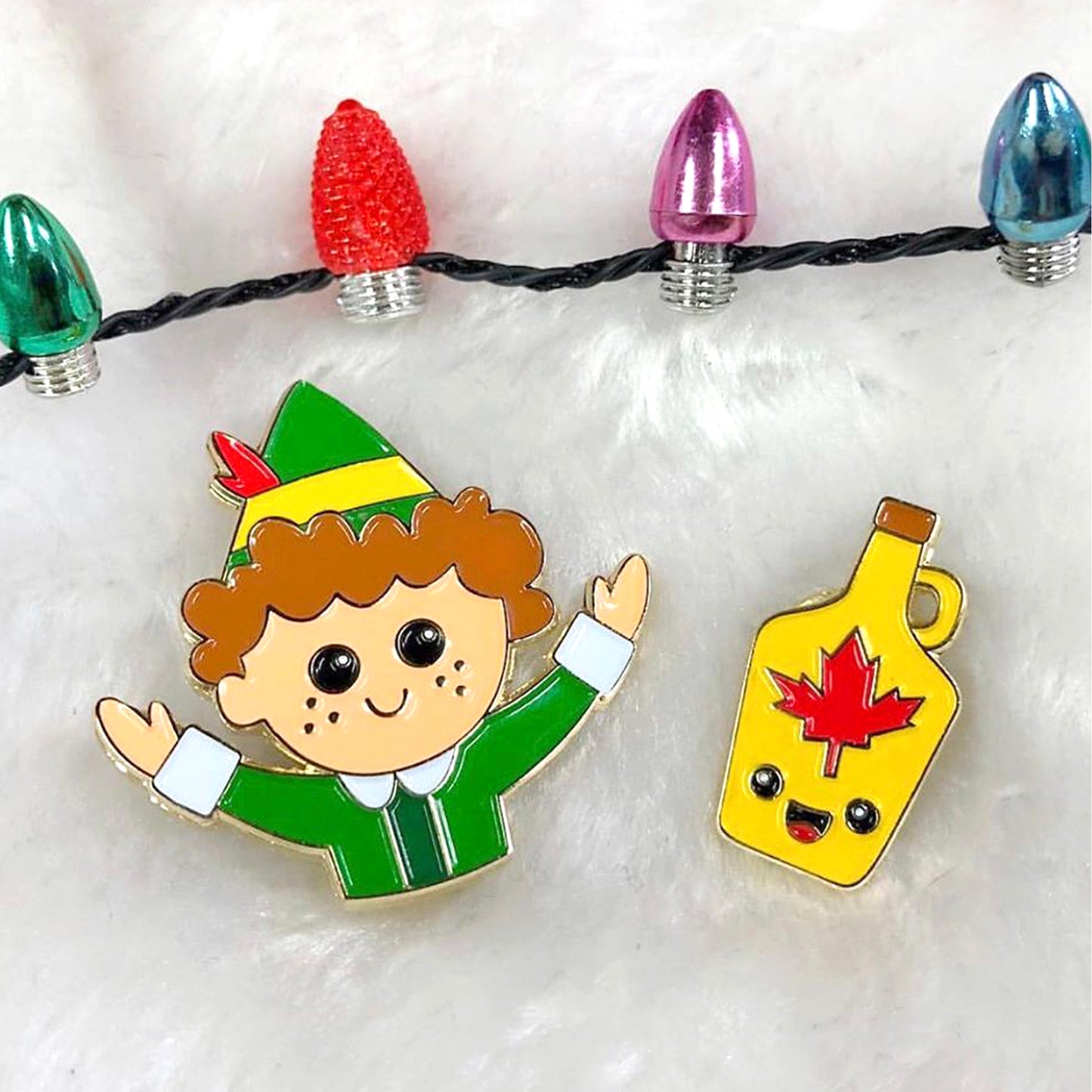 Buddy the Elf and Maple Syrup enamel pin set with a string of lights