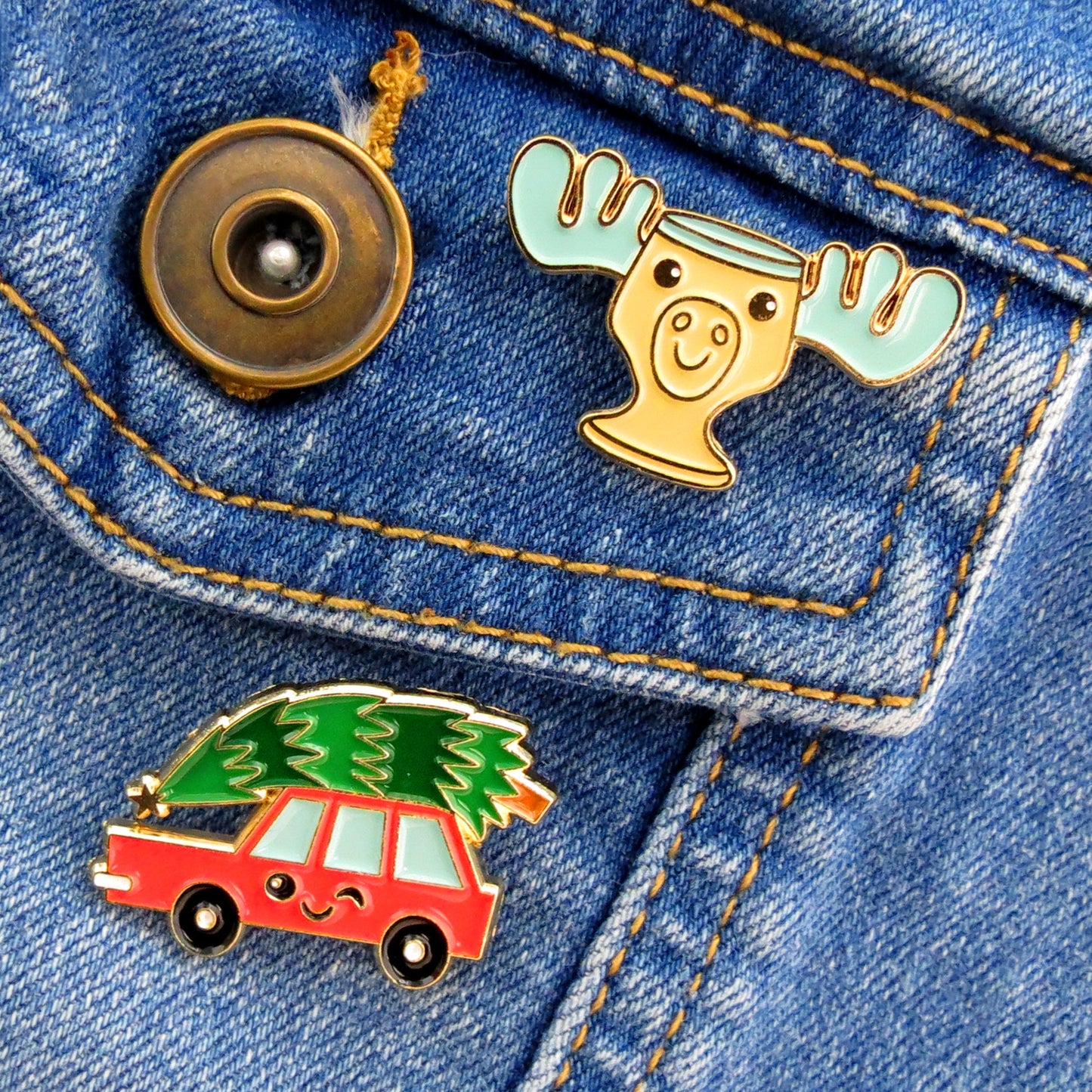 Christmas Vacation Car and Moose Mug enamel pins on jean jacket pocket