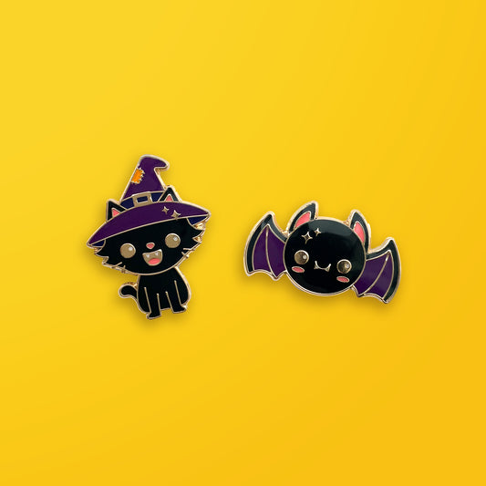 Halloween Cat and Bat enamel pin set on orange background