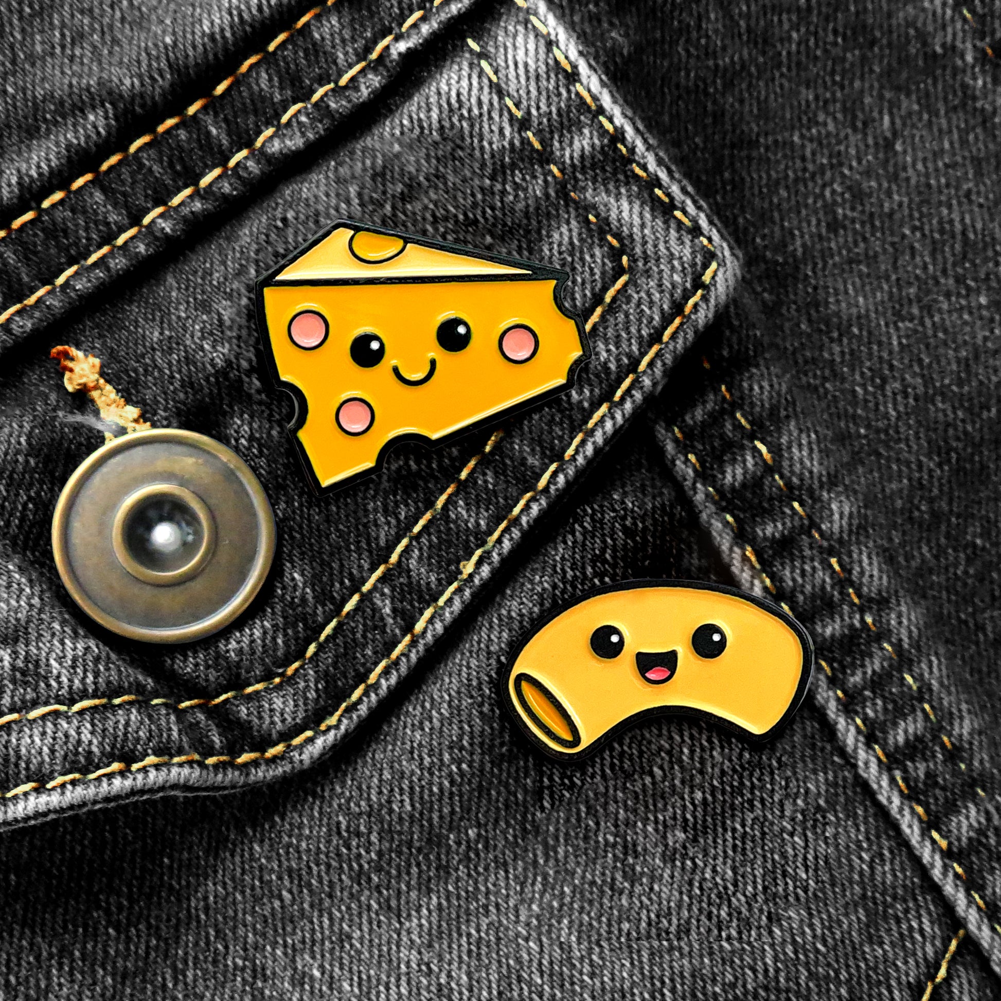Mac and Cheese enamel pins on black jean jacket pocket