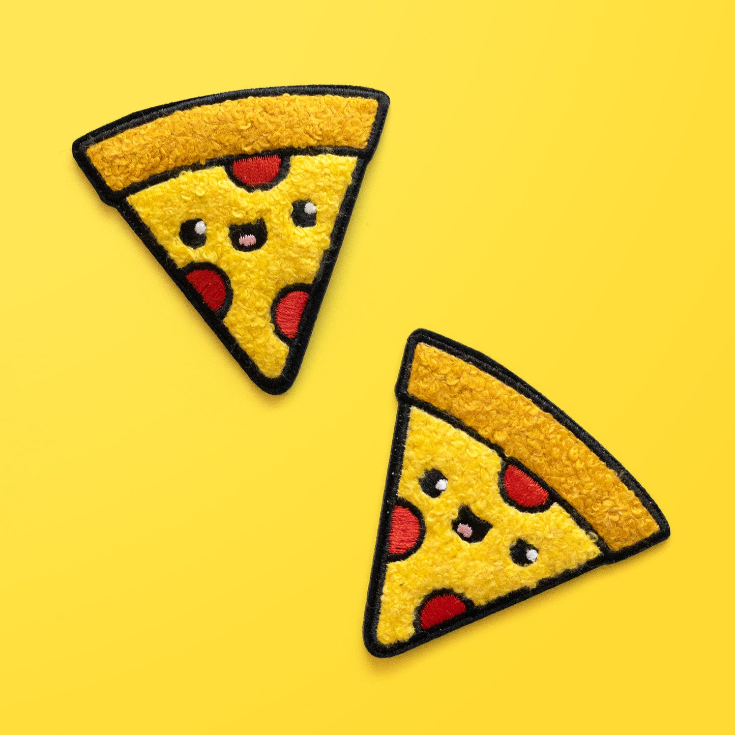 Two Pizza iron on chenille patches on yellow background