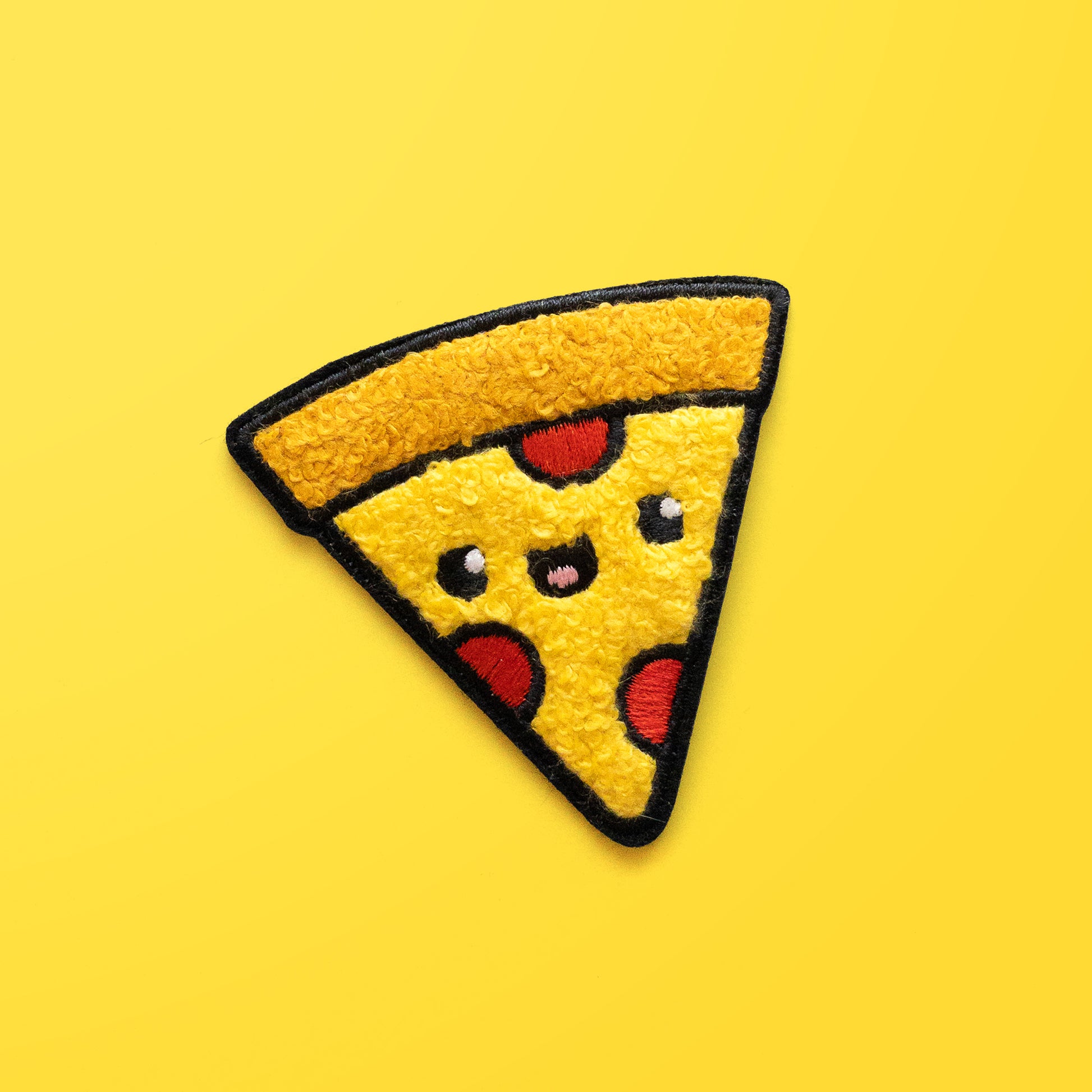 Pizza iron on chenille patch on yellow background