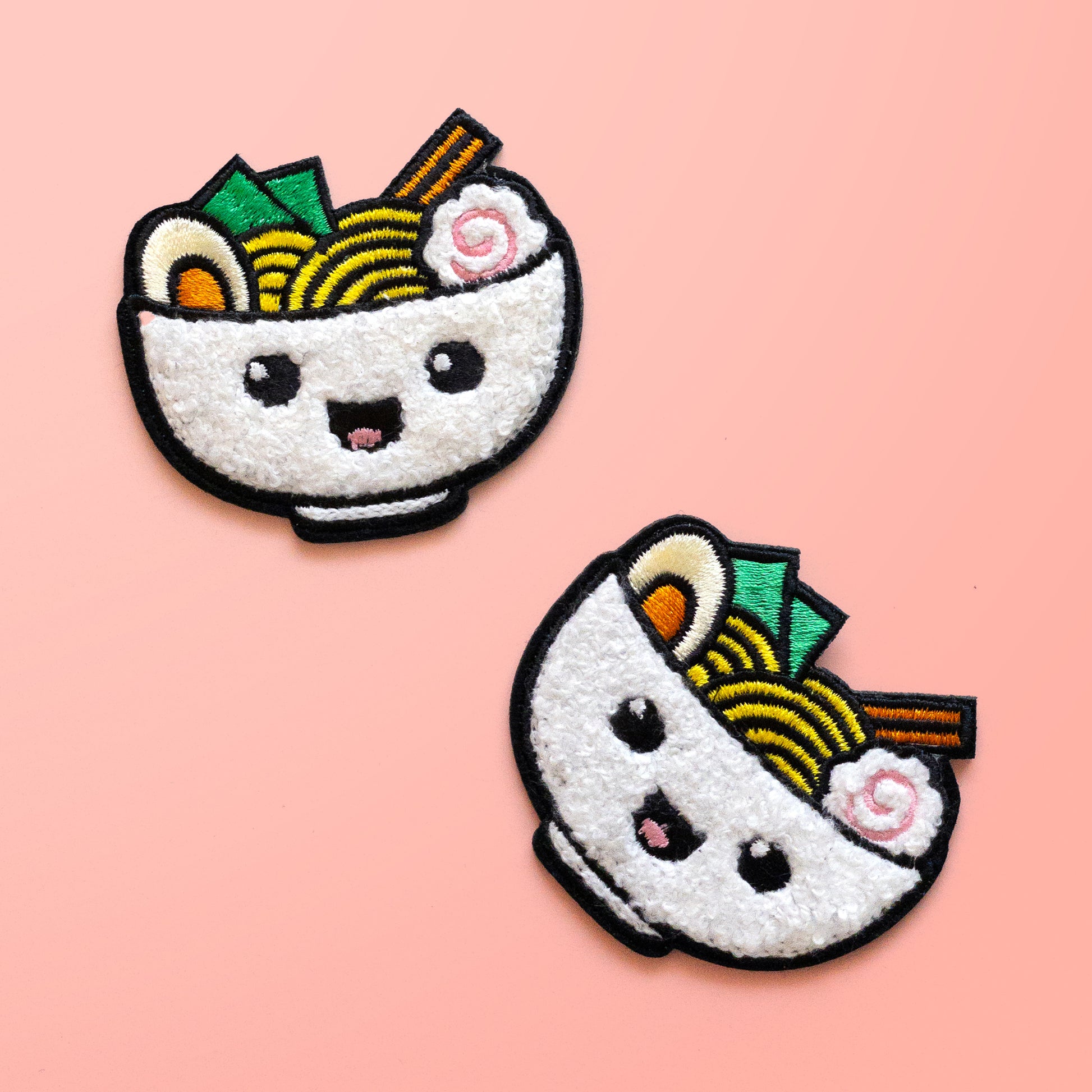 Two Ramen iron on chenille patches on pink background
