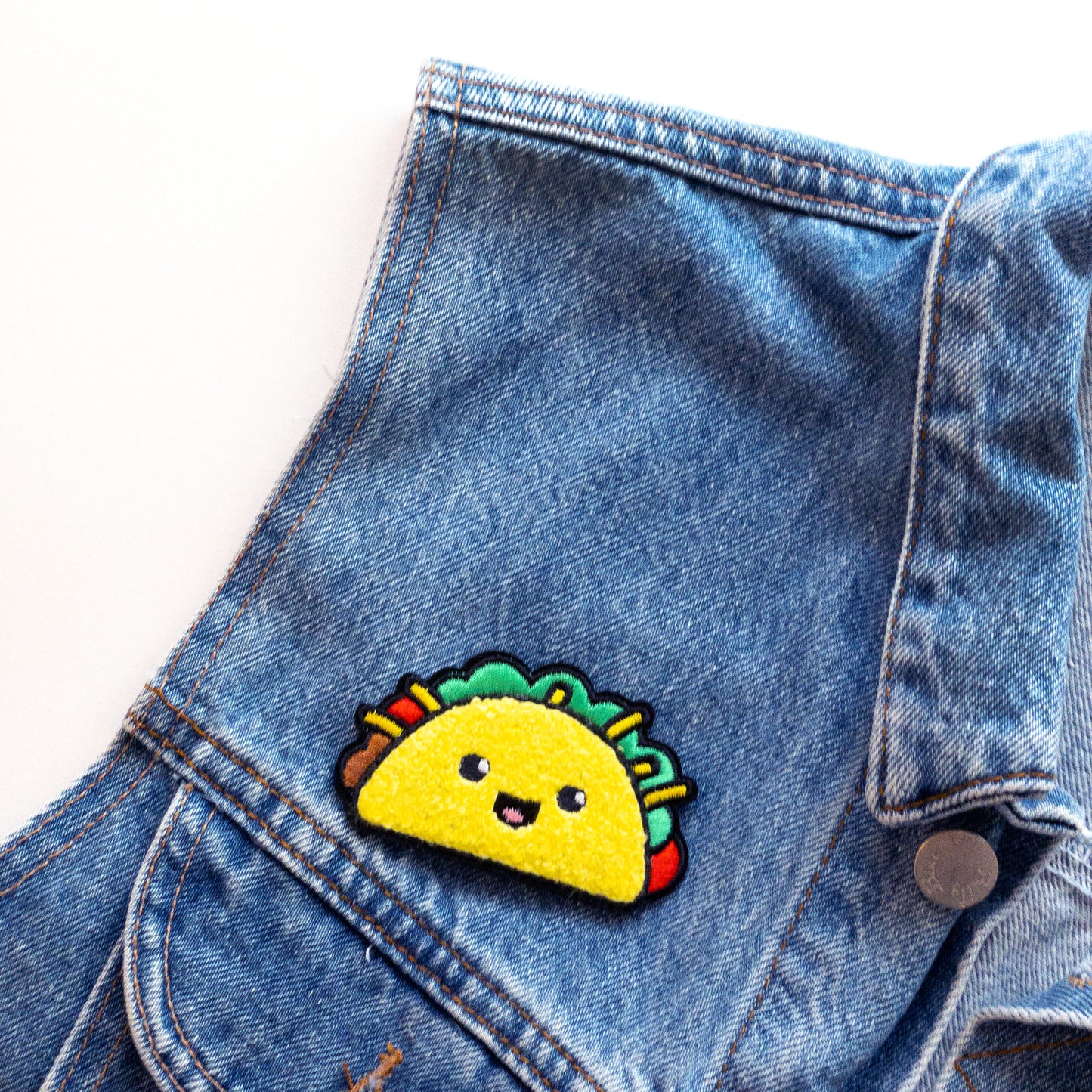 Taco iron on chenille patch on jean jacket