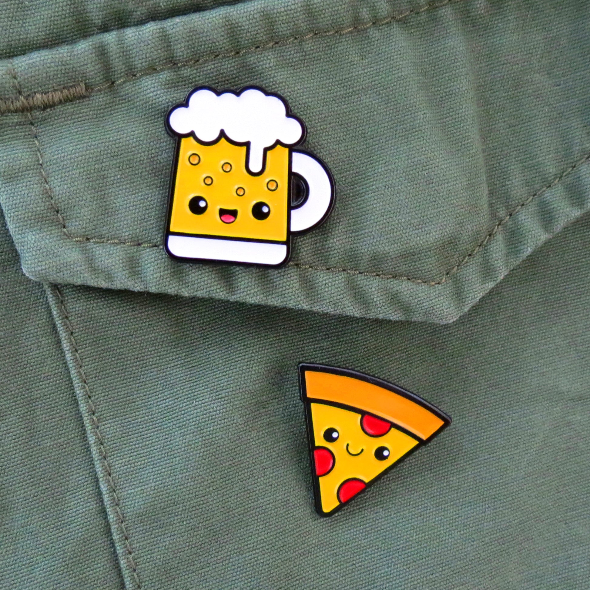Pizza and Beer enamel pins on olive green canvas jacket pocket