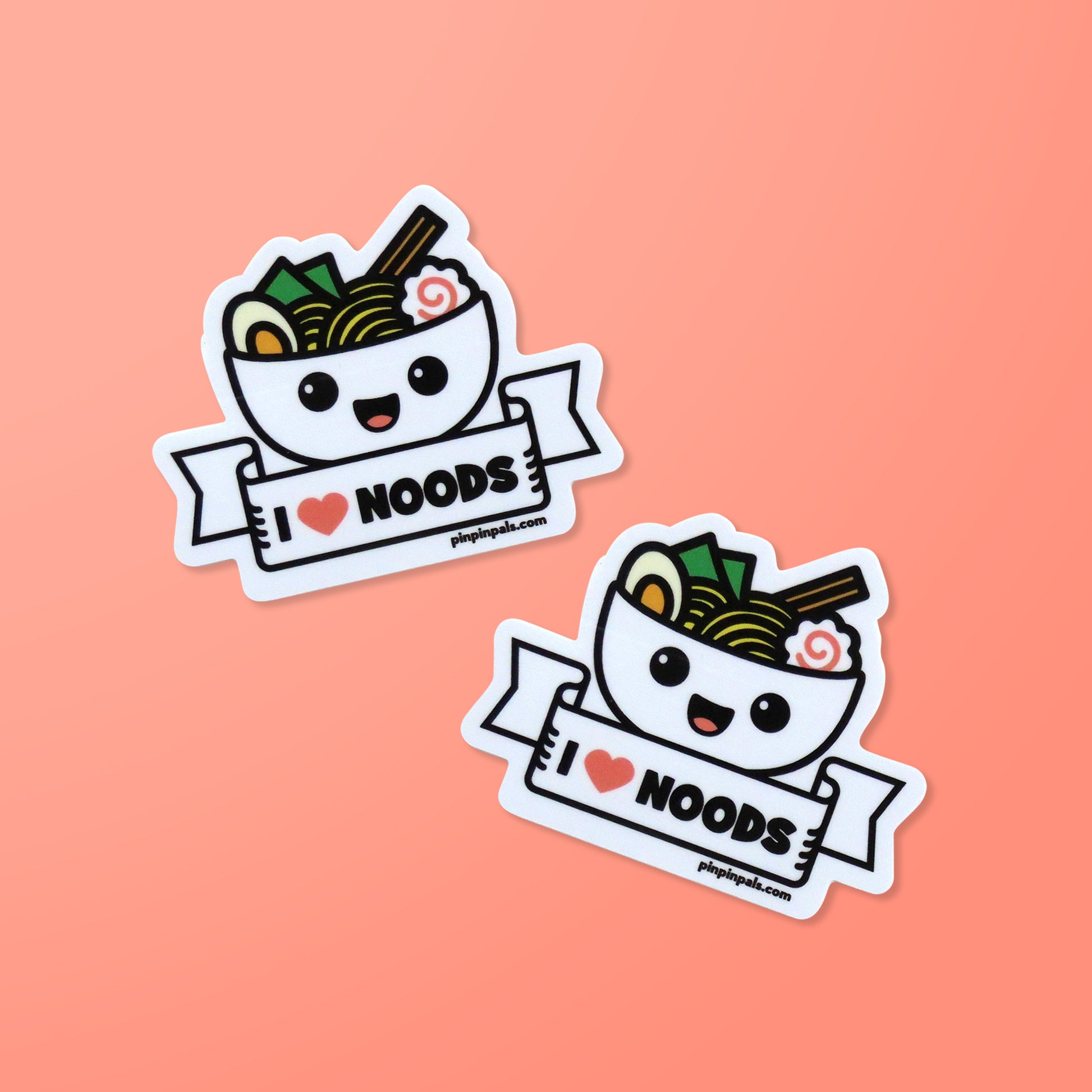 Two I Love Noods vinyl stickers on pink background