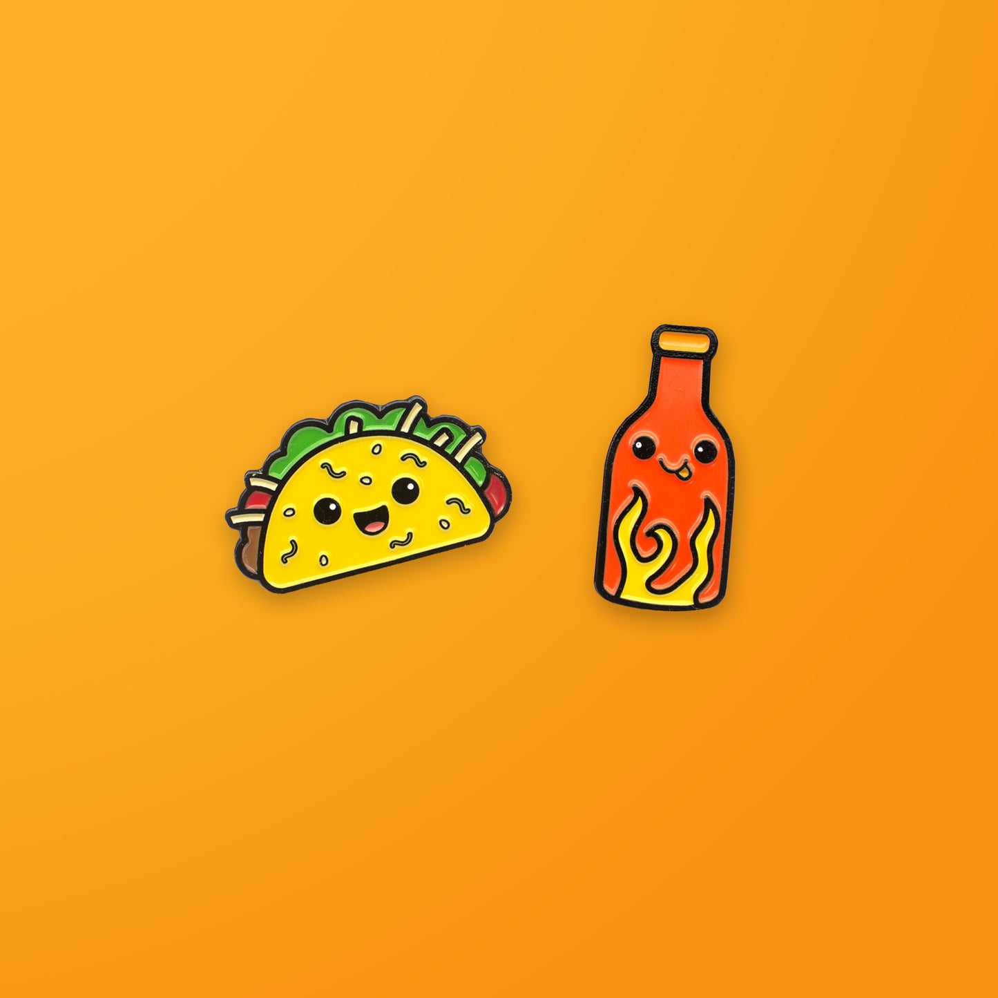 Taco and Hot Sauce enamel pin set on orange background