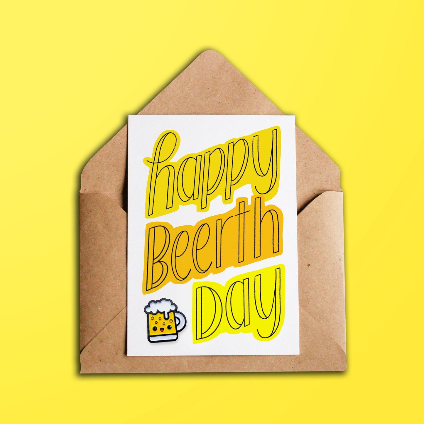Happy Beerthday greeting card over kraft brown envelope on yellow background
